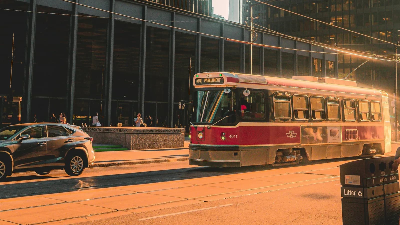 Toronto streetcar passing modern city buildings