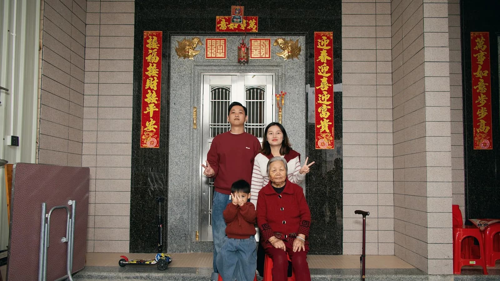 Multigenerational family gathered outside their home