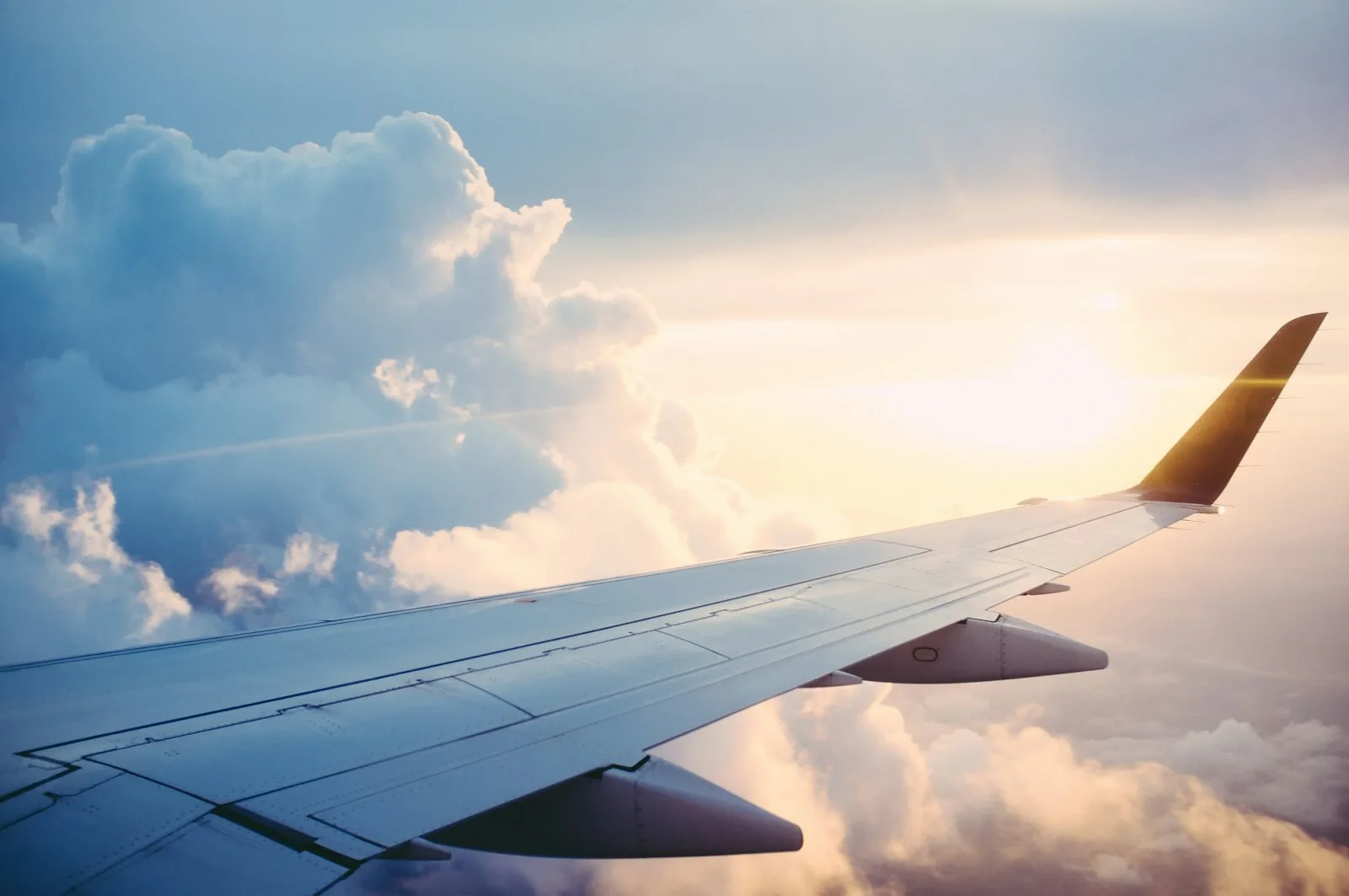 Airplane wing above the clouds