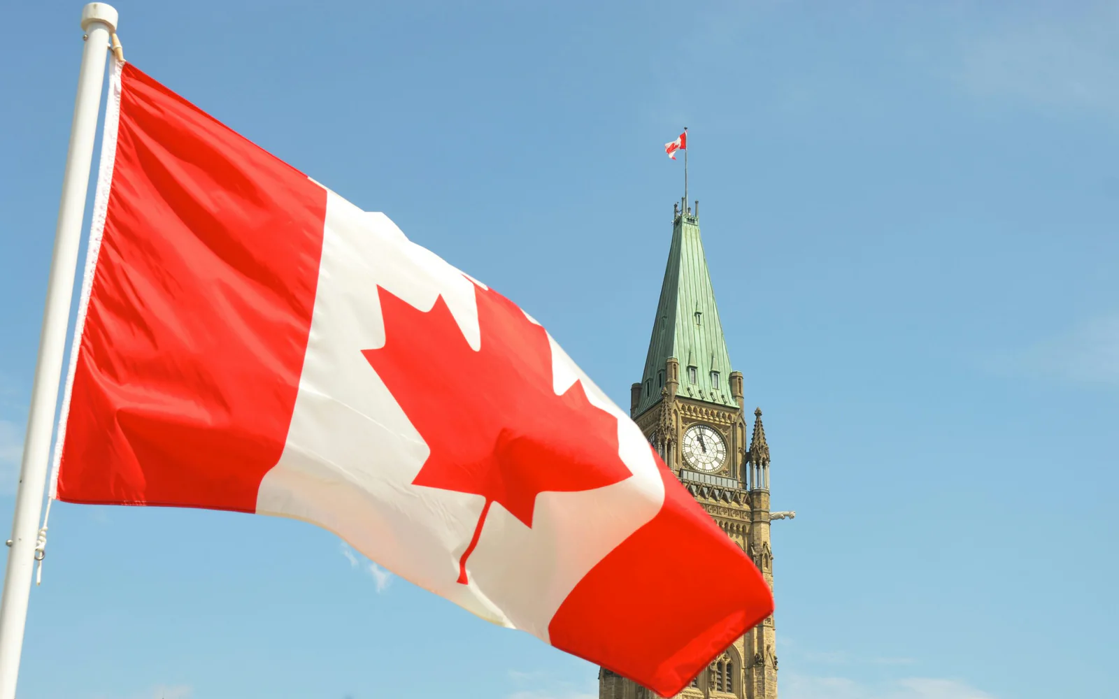 Canadian flag waving outside a building